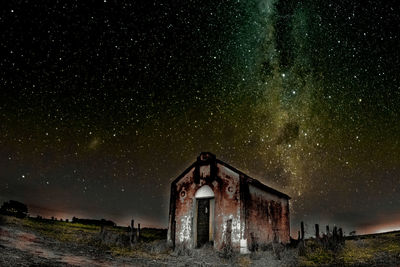 Old building against sky at night