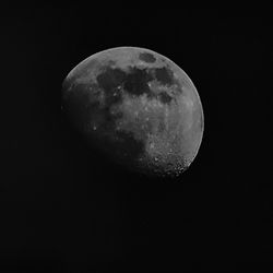 Low angle view of moon against sky at night