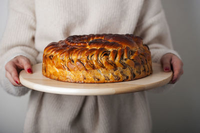 Midsection of woman holding dessert