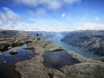 Scenic view of lake and mountains against sky