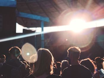 Rear view of people enjoying at music concert