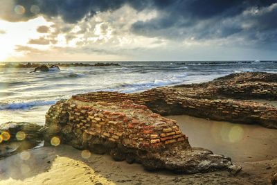 Scenic view of sea against cloudy sky