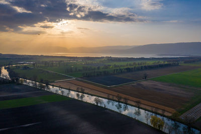 Scenic view of landscape against sky during sunset