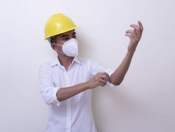 Low section of woman working over white background