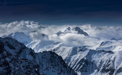 Scenic view of snowcapped mountains against sky