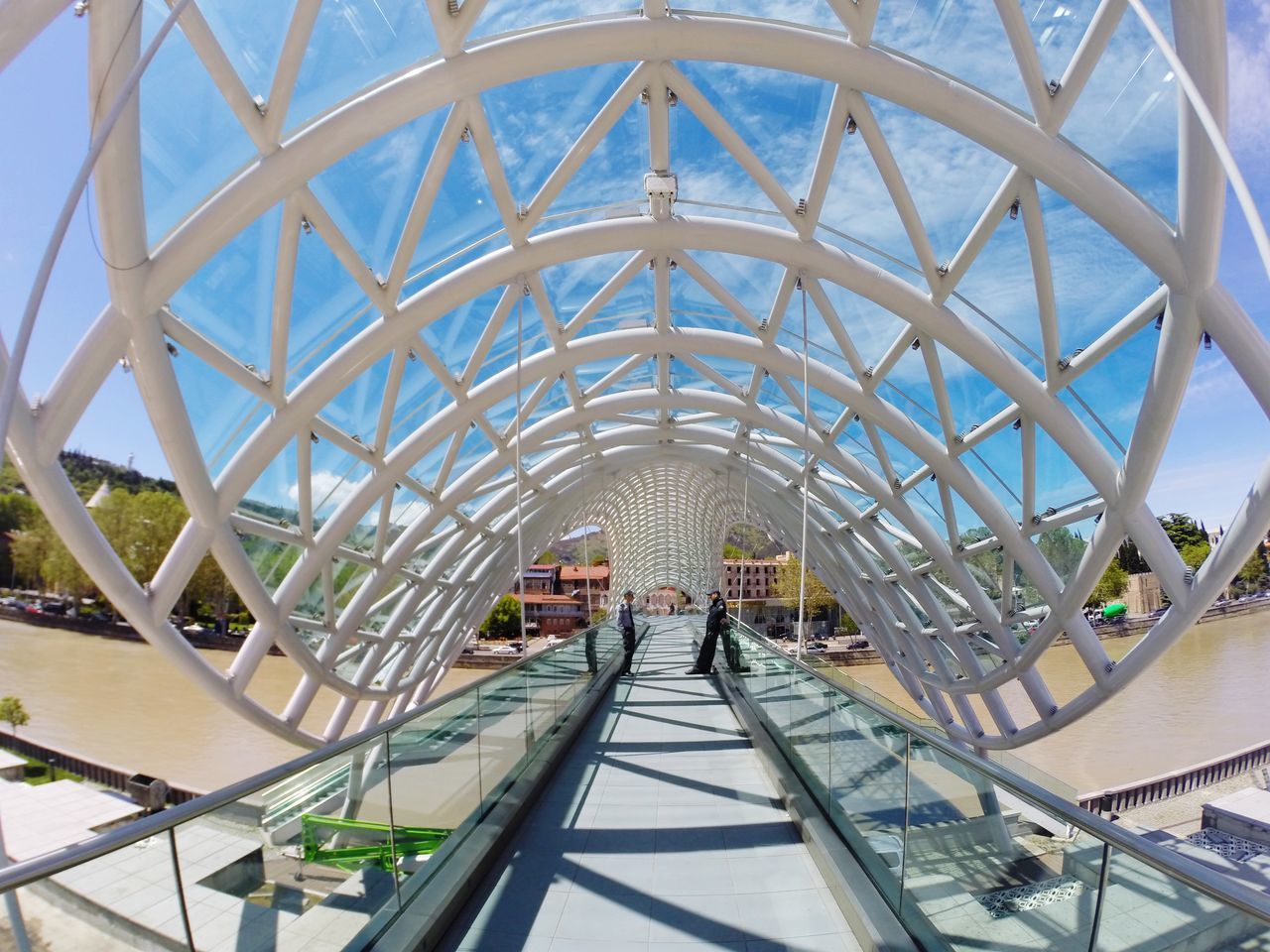 architecture, built structure, indoors, transportation, bridge - man made structure, metal, railing, connection, pattern, modern, ceiling, travel, engineering, diminishing perspective, the way forward, day, travel destinations, incidental people, famous place