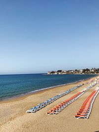 Scenic view of beach against clear blue sky