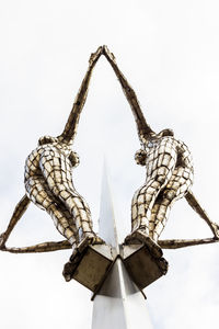 Low angle view of traditional windmill against clear sky