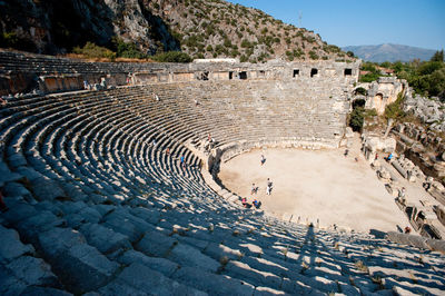 Tourists visiting ancient amphitheater