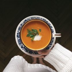 Low section of woman holding soup