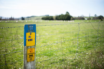 Information sign on grassy field
