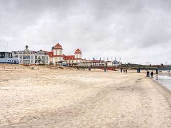 View of beach and buildings against sky