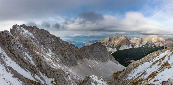 Scenic view of snowcapped mountains against sky