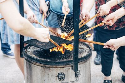 Midsection of people preparing food