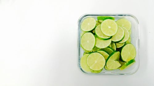 Close-up of fruit over white background