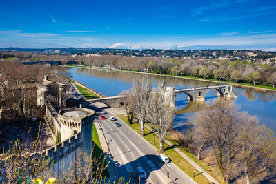 Bridge over river against blue sky