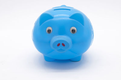 Close-up of blue toy over white background