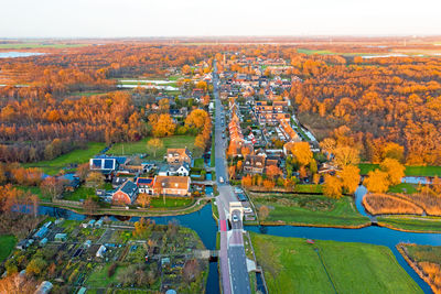 Aerial from the village ankeveen in the contryside in the netherlands in fall