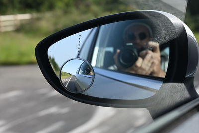 Selfie in car mirror on the way to better tomorrow