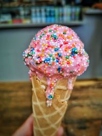 Close-up of hand holding ice cream