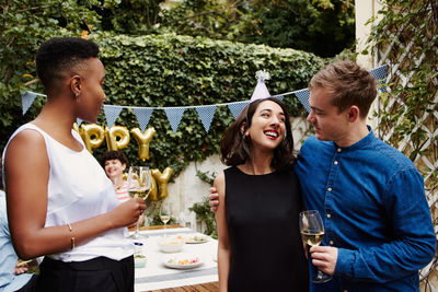 Friends celebrating birthday outdoors