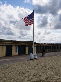 Built structure on beach against sky