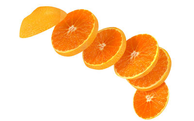 Close-up of orange fruit against white background