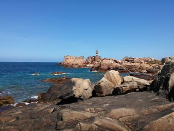 Scenic view of sea against clear blue sky