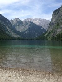 Scenic view of lake and mountains against sky