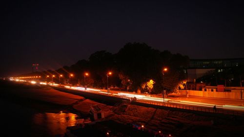 High angle view of illuminated street at night