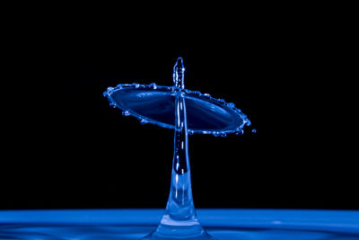 Close-up of water splashing against black background