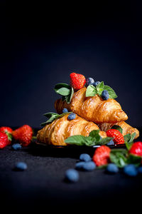 Close-up of fruits against black background