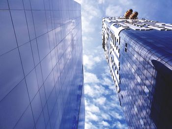 Low angle view of modern buildings against sky