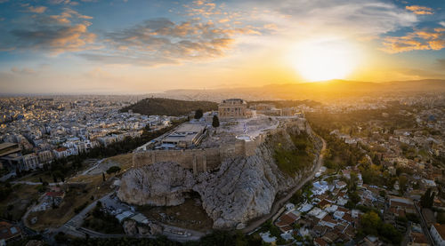 Aerial view of townscape against sky during sunset