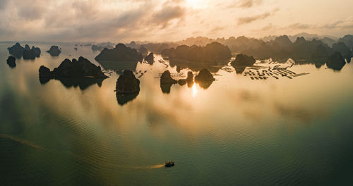 Panoramic view of sea against sky during sunset