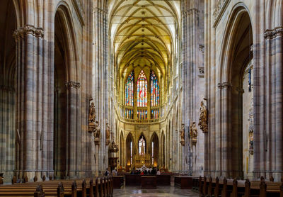 Interior inside the catholic cathedral in prague. faith and worship concept.