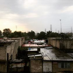 Buildings against cloudy sky