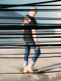 Low section of person walking on road