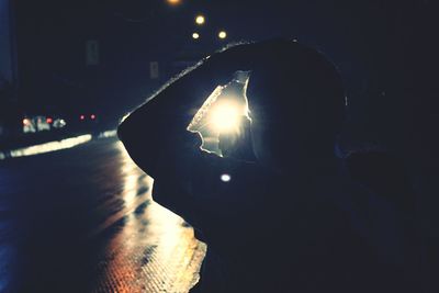 Silhouette of woman at night