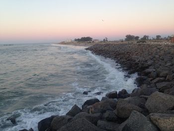 Scenic view of sea against sky at sunset