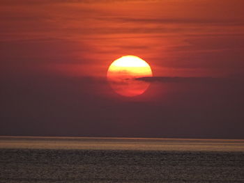 Scenic view of sea against sky at sunset