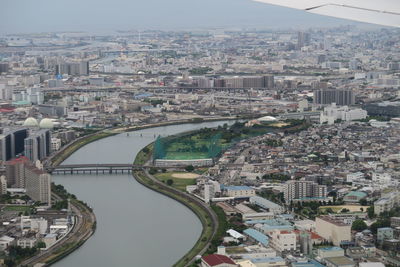 High angle view of river amidst buildings in city