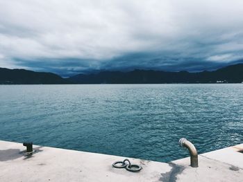 Scenic view of lake against sky during winter