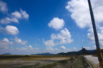 Scenic view of landscape against blue sky