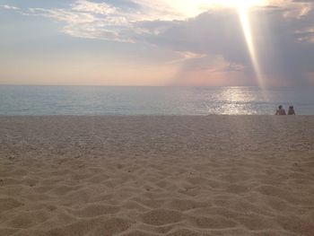 Scenic view of beach against sky during sunset