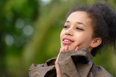 Portrait of smiling young woman outdoors