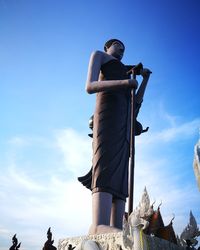 Low angle view of statue against cloudy sky