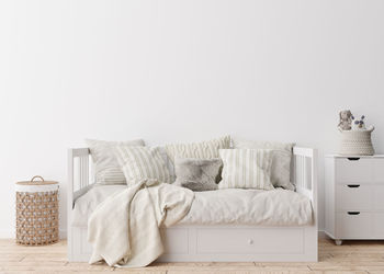 Empty white wall in modern child room. mock up interior in scandinavian style. free, copy space 