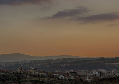 Scenic view of mountains against sky during sunset