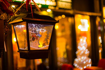 Close-up of illuminated lantern hanging outdoors